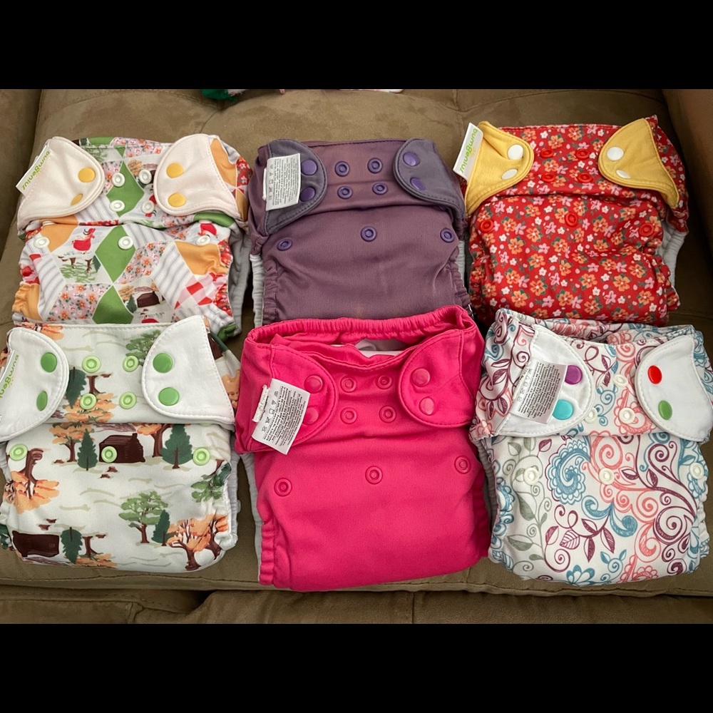 6 used BumGenius cloth diapers.